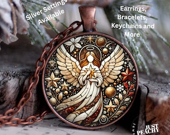 May include: A copper-toned pendant necklace featuring a detailed angel design. The angel holds a star, surrounded by stars and decorative elements. The text "Silver Settings Available" and "Earrings, Bracelets, Keychains and More" are visible.