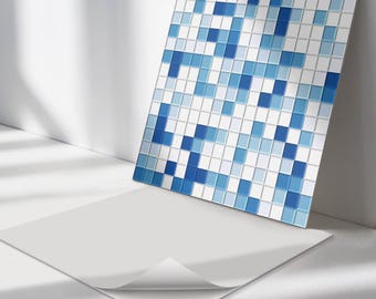 May include: A sheet of blue and white mosaic tile with a peel and stick adhesive backing. The tile is made up of small squares in various shades of blue and white.