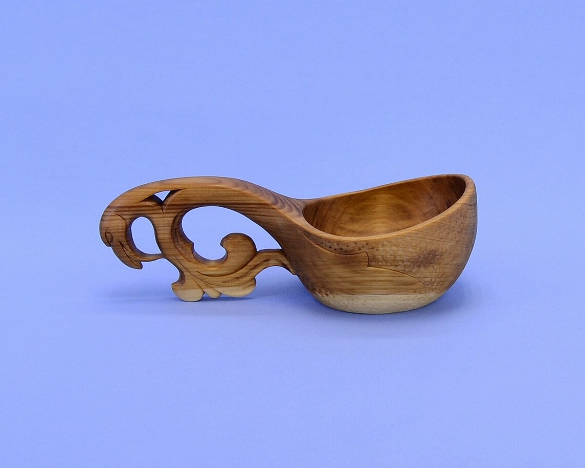 Handmade wooden bucket handle with a Griffin's head on Etsy