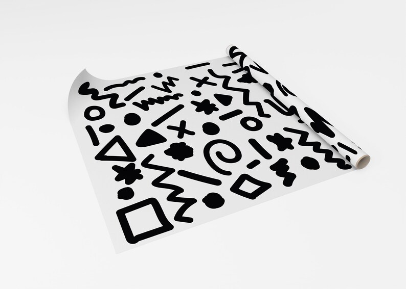 May include: A roll of white paper featuring a repeating pattern of black abstract shapes, such as zigzags, circles, and triangles. The paper is partially unrolled, displaying the design. The overall theme is modern and geometric.