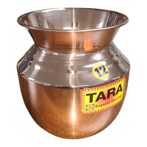 May include: A shiny copper pot with a wide mouth and a rounded body. The pot has a sticker on the side that says "TARA Export Quality" and "12".