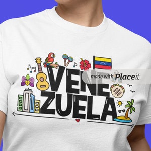 May include: White t-shirt with a black graphic design that says "Venezuela" with various colorful icons including a parrot, a guitar, a palm tree, a city skyline, and the Venezuelan flag. The text "made with Placeit" is also included in the design.