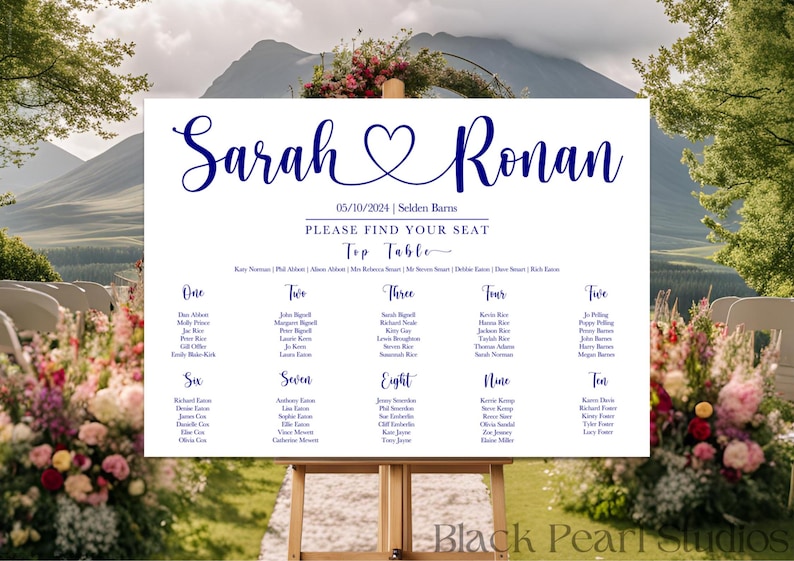 May include: A wedding seating chart on a wooden easel, with the names "Sarah & Ronan" in elegant navy blue script. The date "05/10/2024" and "Please Find Your Seat" are also displayed. The chart lists table numbers and guest names.