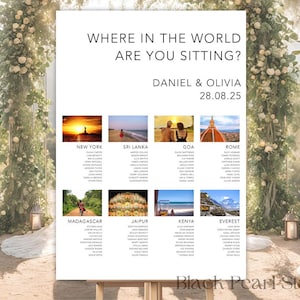 May include: A white wedding seating chart with the text "WHERE IN THE WORLD ARE YOU SITTING?" and the names Daniel & Olivia, with the date 28.08.25. The chart includes photos of New York, Sri Lanka, Goa, Rome, Madagascar, Jaipur, Kenya, and Everest.