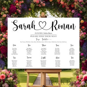 May include: A white wedding seating chart with black calligraphy text. The names "Sarah" and "Ronan" are at the top, with a heart symbol between them. The date is 05/10/2024. The words "Please Find Your Seat" are also visible.