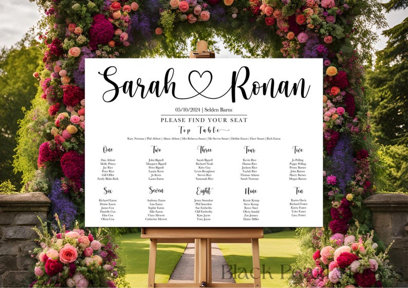 May include: A white wedding seating chart with black calligraphy text. The names "Sarah" and "Ronan" are at the top, with a heart symbol between them. The date is 05/10/2024. The words "Please Find Your Seat" are also visible.