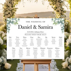 May include: A wedding seating chart with a white background and green eucalyptus leaves in the corners. The text reads "The Wedding of Daniel & Samira" and "05/10/2024 | Addington Palace". The chart lists the names of guests for each table number, from one to fifteen.