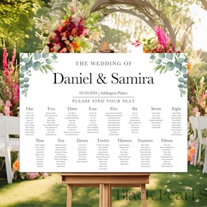 May include: A wedding seating chart with a white background and green eucalyptus leaves. The chart is titled "The Wedding of Daniel & Samira" and lists the names of guests for each table number. The date and location of the wedding are also included: "05/10/2024 | Addington Palace".