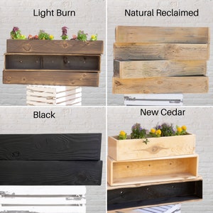 May include: Four different styles of wooden planter boxes. The top left box is stained a light brown color and labeled "Light Burn". The top right box is made of reclaimed wood and labeled "Natural Reclaimed". The bottom left box is stained black and labeled "Black". The bottom right box is made of new cedar and labeled "New Cedar".