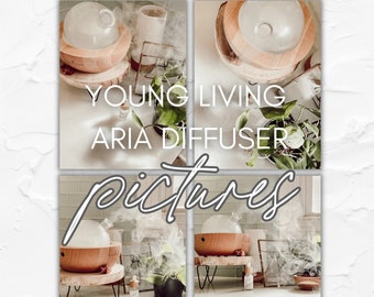 May include: A Young Living Aria diffuser with a wooden base and a glass top. The diffuser is surrounded by plants and other essential oil products. The text "Young Living Aria Diffuser" is visible in the image.