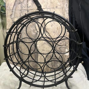 Vintage Late 1900s Circular Black Wrought Iron Metal Wine Rack For Wine Bottle Stories