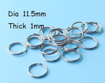 May include: A pile of silver key rings, each with a diameter of 11.5 mm and a thickness of 1 mm.  Dia 11.5mm Thick 1mm