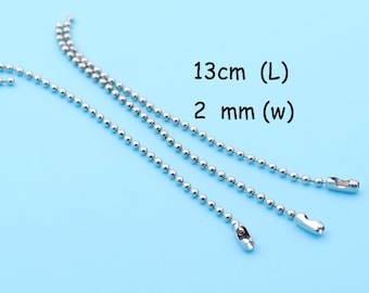 May include: Three silver ball chains with a clasp on each end. The chains are 13 cm (L) and 2 mm (W).