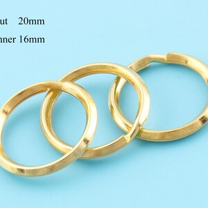 May include: Three gold-colored key rings, each with an outer diameter of 0.79 inches and an inner diameter of 0.63 inches, are interlocked. The key rings are displayed against a light blue background.