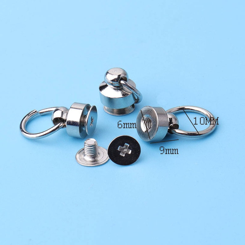 May include: Three silver metal snap fasteners with a loop and a screw. The fasteners are 6 mm, 9 mm, and 10 mm in diameter.