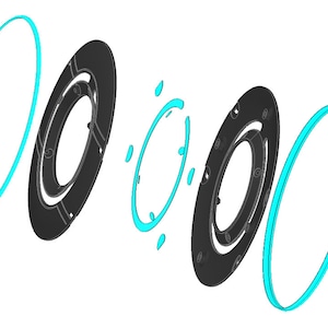 May include: A set of four black and turquoise rings, with two of the rings having a center hole. The rings are arranged in a staggered pattern.