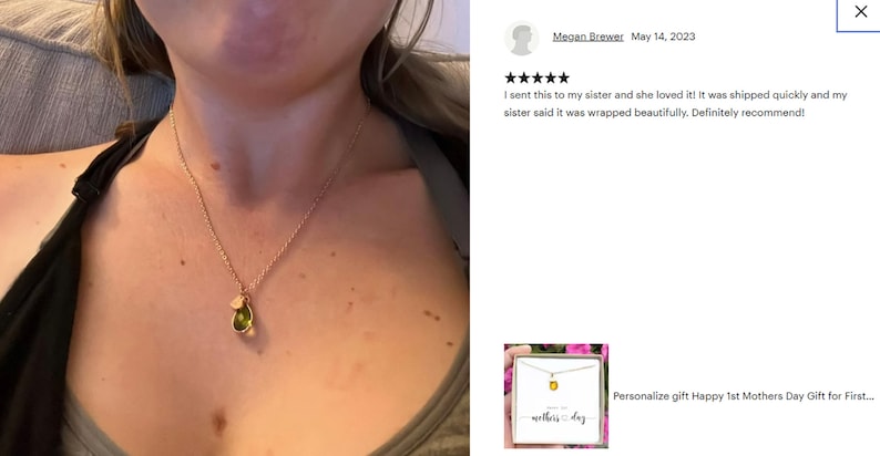 May include: Gold-toned necklace with a pendant featuring a green gemstone and a small charm. The necklace is worn on a person. The image also includes a customer review and a product image with the text "Personalize gift Happy 1st Mothers Day Gift for First..."