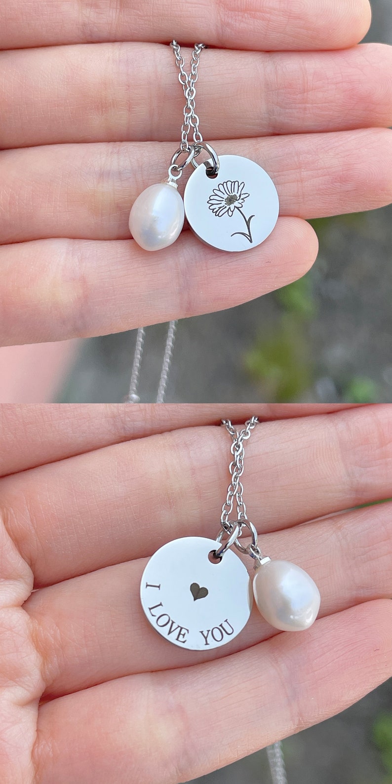 May include: Two silver necklaces with a pearl charm and a silver disc charm. The first necklace has a flower design on the disc charm. The second necklace has the words "I LOVE YOU" and a small heart on the disc charm.
