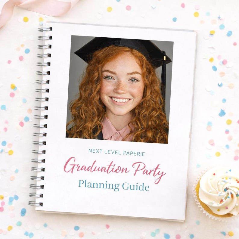 May include: A spiral-bound Graduation Party Planning Guide with a photo of a smiling graduate wearing a cap. The cover features the text "Graduation Party Planning Guide" in pink and teal. A cupcake with white frosting is in the corner.
