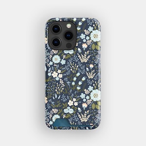 May include: A navy blue phone case with a floral design. It features light blue, white, and peach flowers with green leaves and stems. The case has a camera cutout and a card slot.