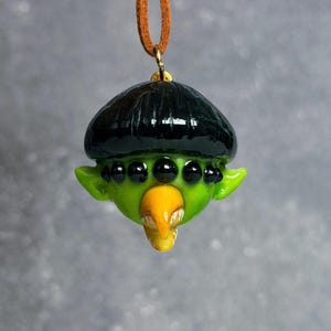 Alien boy sculpture necklace inspired by Oliver tree