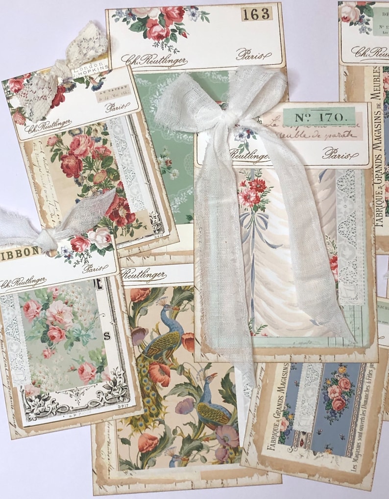 May include: A collection of vintage fabric samples with floral and peacock designs. The samples are labeled with the name "Ch. Reutlinger" and the location "Paris".