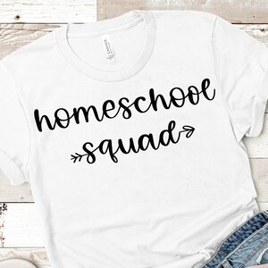 May include: White t-shirt with black text that reads "homeschool squad" with an arrow pointing to the right.