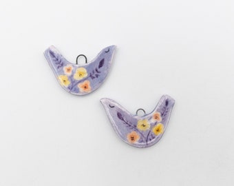 Ceramic bird pendants, hand painted on both sides, ideal for creating earrings and other jewelry.