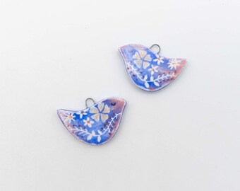 Ceramic bird pendants, hand painted on both sides, ideal for creating earrings and other jewelry.