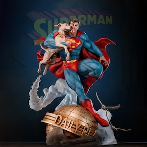 May include: A Superman statue in a dynamic pose, holding a dog. The figure wears the iconic blue suit with a red cape and boots. The statue stands on a globe with "DAILY PLANET" text. The background features the Superman logo.