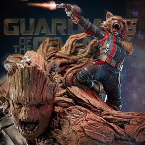 May include: A detailed collectible statue featuring Rocket Raccoon in a dark blue and red tactical suit firing a blaster, standing atop a large, textured, brown wooden Groot figure with an open-mouthed expression, set against a Guardians of the Galaxy backdrop.