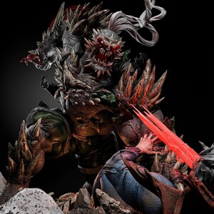 May include: A detailed statue of a monstrous figure with sharp, spiky protrusions and a menacing expression. The figure is dark with red accents, and appears to be battling another figure with red energy beams. The base is rocky.
