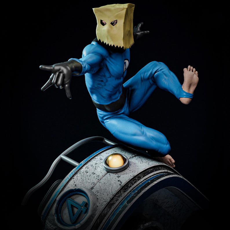 May include: A blue superhero figure with a paper bag mask and black gloves. The figure is posed mid-air, with one foot extended and the other leg bent. The figure is on a metallic surface with a light.