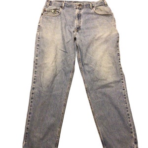 May include: A pair of light blue denim jeans with a straight leg fit.