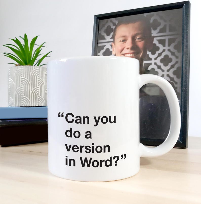 May include: White ceramic coffee mug with black text that reads "Can you do a version in Word?"