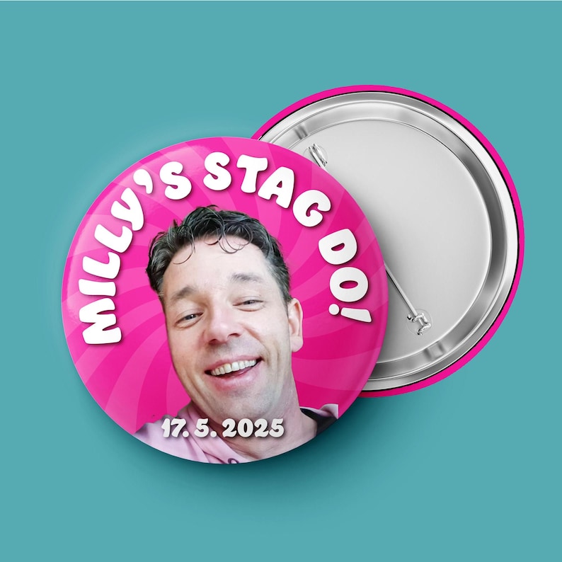 May include: A round pin-back button featuring a photograph of a smiling person. The background is a bright pink radial pattern with the white text "MILLY'S STAG DO!" arched at the top and the date "17. 5. 2025" printed in white at the bottom.
