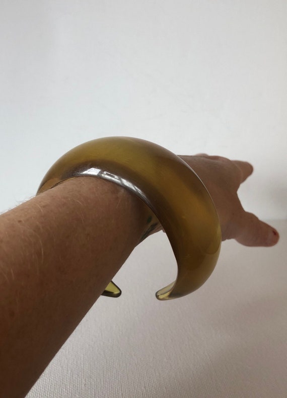 SALE Old plastic bangle odd cut out back yellowish