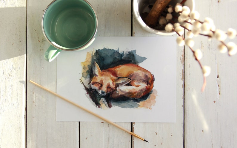 May include: A watercolor painting of a curled up fox sleeping on a branch. The fox is painted in shades of orange, brown, and white. The background is a soft blue and green.