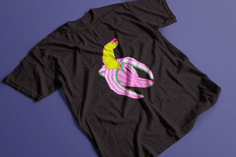 May include: A black t-shirt with a graphic of a pink banana with a green finger sticking out.