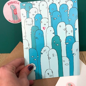 May include: A blue and white illustration of a crowd of people with different facial expressions. One person in the center of the crowd has a small red heart above their head.