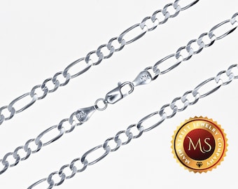May include: A silver chain necklace with a figaro link pattern. The chain is shown in three layers, with a clasp at the end. The chain is made of 925 sterling silver.