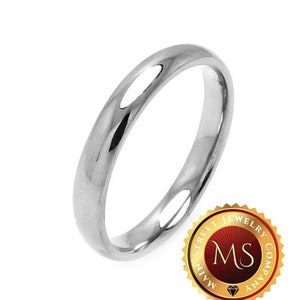 May include: A polished, silver-colored ring with a rounded band. The ring is set against a white background. A gold-colored seal with the text "Main Street Jewelry Company" and the initials "MS" is in the lower right corner.