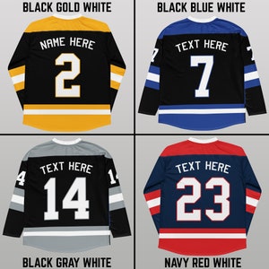 May include: Four hockey jerseys with different color combinations. The jerseys are black with white and colored stripes. The jerseys have numbers and text on the back. The text on the jerseys says "Name Here" and "Text Here".
