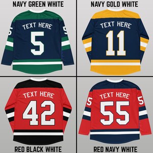 May include: Four hockey jerseys with different color combinations. The jerseys are navy blue, green, white, gold, red, and black. Each jersey has a number on the back, with the text "TEXT HERE" above the number. The numbers are 5, 11, 42, and 55.