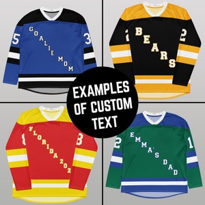 May include: Four hockey jerseys with different colors and custom text. The jerseys are black, blue, red, and green. The text on the jerseys includes "Goalie Mom", "Bears", "Florida 202", and "Emma's Dad".