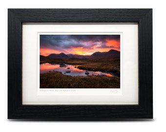 May include: A framed photograph of a landscape with a lake reflecting a colorful sunset over mountains. The text "FANNICH MOUN AND AN  MINNOW POOL" is printed below the image.