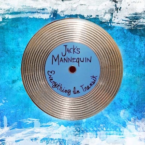 May include: A gold vinyl record with a blue label that says "Jack's Mannequin Everything In Transit".