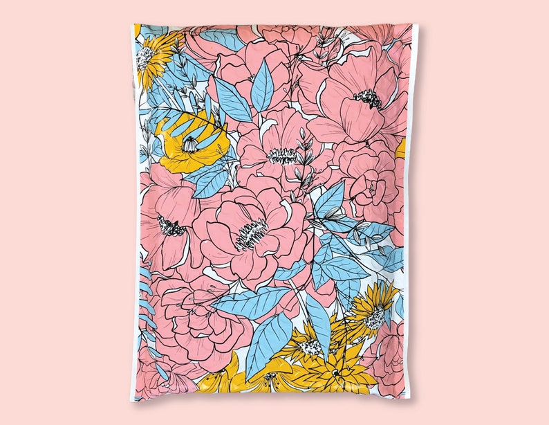 May include: A white poly mailer with a floral pattern. The pattern features pink, yellow, and blue flowers on a white background.