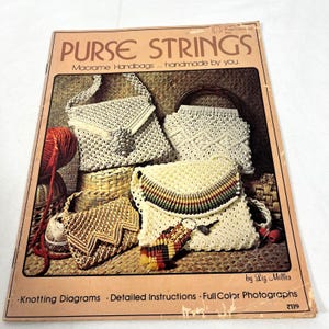May include: A craft instruction booklet titled Purse Strings featuring macrame handbags handmade by you. The cover displays four off-white and tan macrame purses with various knot patterns, including one with a colorful striped flap and a keychain.