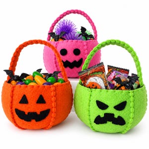 May include: Three felt Halloween baskets in orange, pink, and lime green, each featuring a black jack-o'-lantern face. The orange basket holds colorful candies and plastic bats, the pink one contains a purple spiky ball, and the green one holds candy bags.